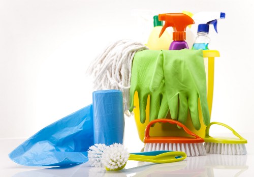 Deep cleaning the kitchen with detailed attention to hidden grease and surfaces